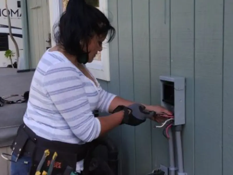 Licensed electrician wiring an exterior subpanel in Yelm